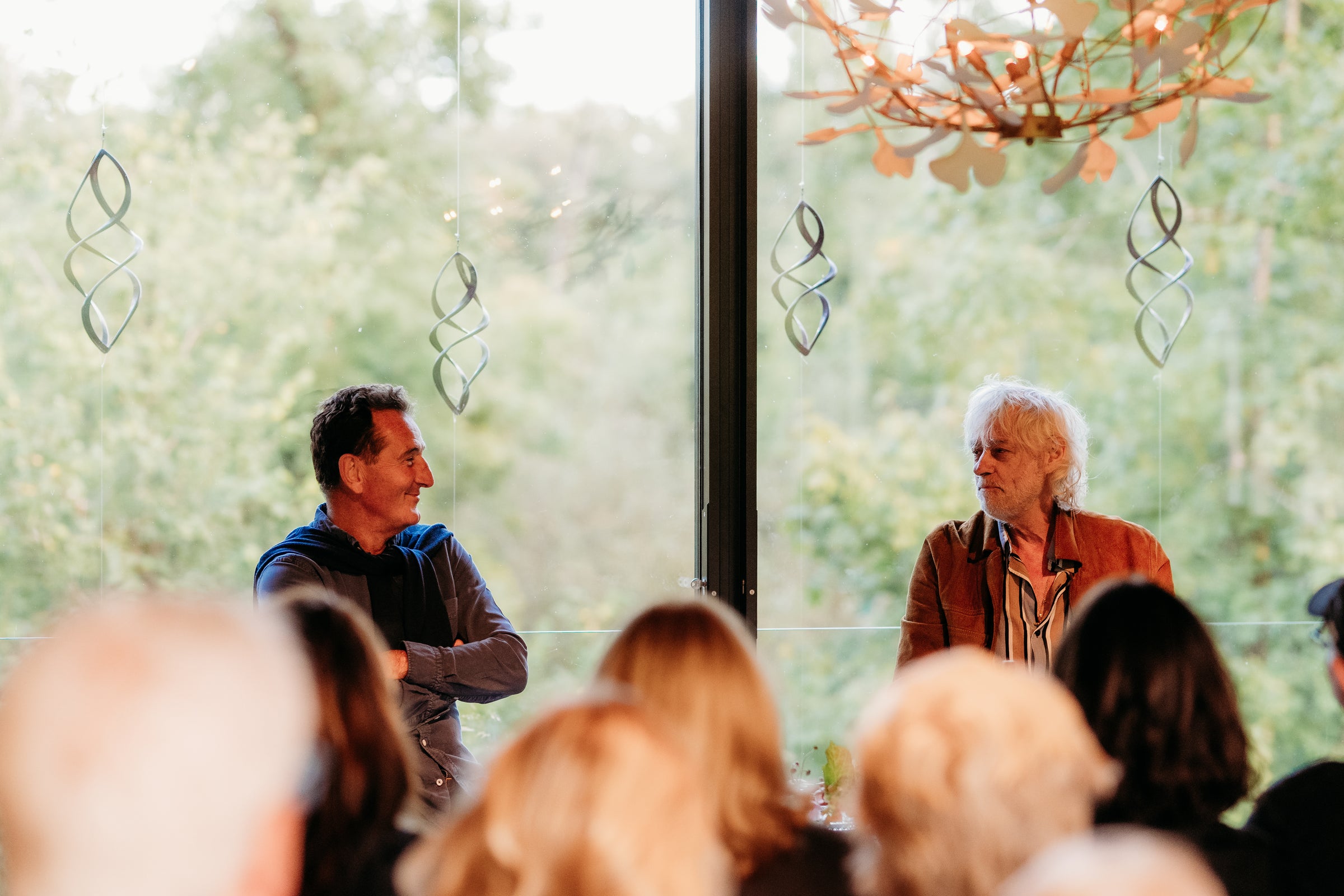 Graham Wrigley and Bob Geldof Framed by Trees in Window of Watch House